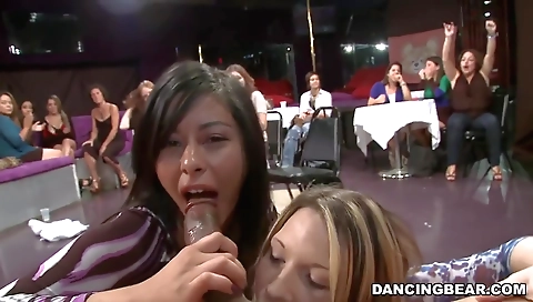 Amateur blonde in stockings sucks a large cock in a group sex clip