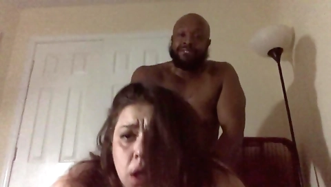 Busty brunette milf sucks a large cock and gets cum on face
