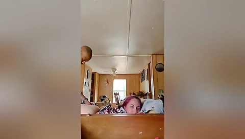 A redheaded hottie with a big cock sucks and fucks