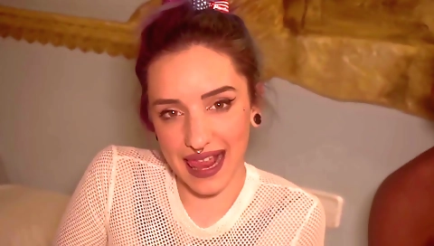 Teenie in stockings shows her ass on the black couch