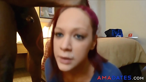 Ebony hottie in her black dress is licking a white dick