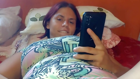 Red-haired babe in white dress fucks a man in front of her lover