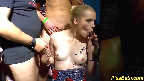 Blonde and tattooed babes get fucked in a group sex show